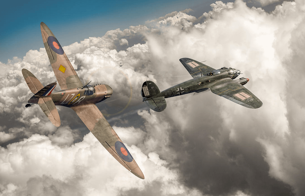 Spitfire attacking Heinkel above clouds