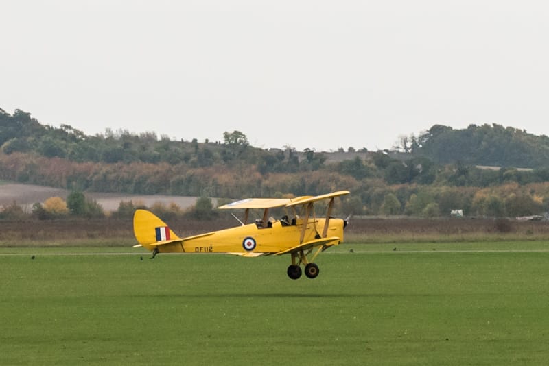 Tiger Moth flight Melanie Wright _DSC4812 G-ANRM taking off on Duxford's grass runway.