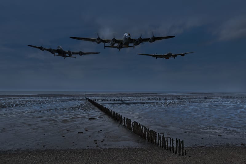 Three 617 Squadron Lancasters low over coast